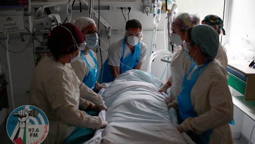 Doctor Alexandre Avenel and medical staff treat a patient suffering from the coronavirus disease (COVID-19) in the Intensive Care Unit (ICU) at the Robert Ballanger hospital in Aulnay-sous-Bois near Paris during the outbreak of the coronavirus disease in France, April 30, 2020. Seine-Saint-Denis, a mainly working class and multiracial suburb, was already lacking doctors and resources before the coronavirus crisis and has seen a bigger spike in mortality than neighbouring Paris. But despite being understaffed, teams at Robert Ballanger hospital reorganized to prioritize emergency health and have worked long hours, giving everything to fight the virus. Picture taken April 30, 2020. REUTERS/Gonzalo Fuentes