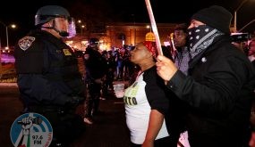 Demonstrators face off with California Highway Patrol officers as they protest the police shooting of Stephon Clark, in Sacramento, California, U.S., March 30, 2018. REUTERS/Bob Strong