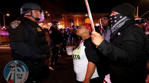 Demonstrators face off with California Highway Patrol officers as they protest the police shooting of Stephon Clark, in Sacramento, California, U.S., March 30, 2018. REUTERS/Bob Strong