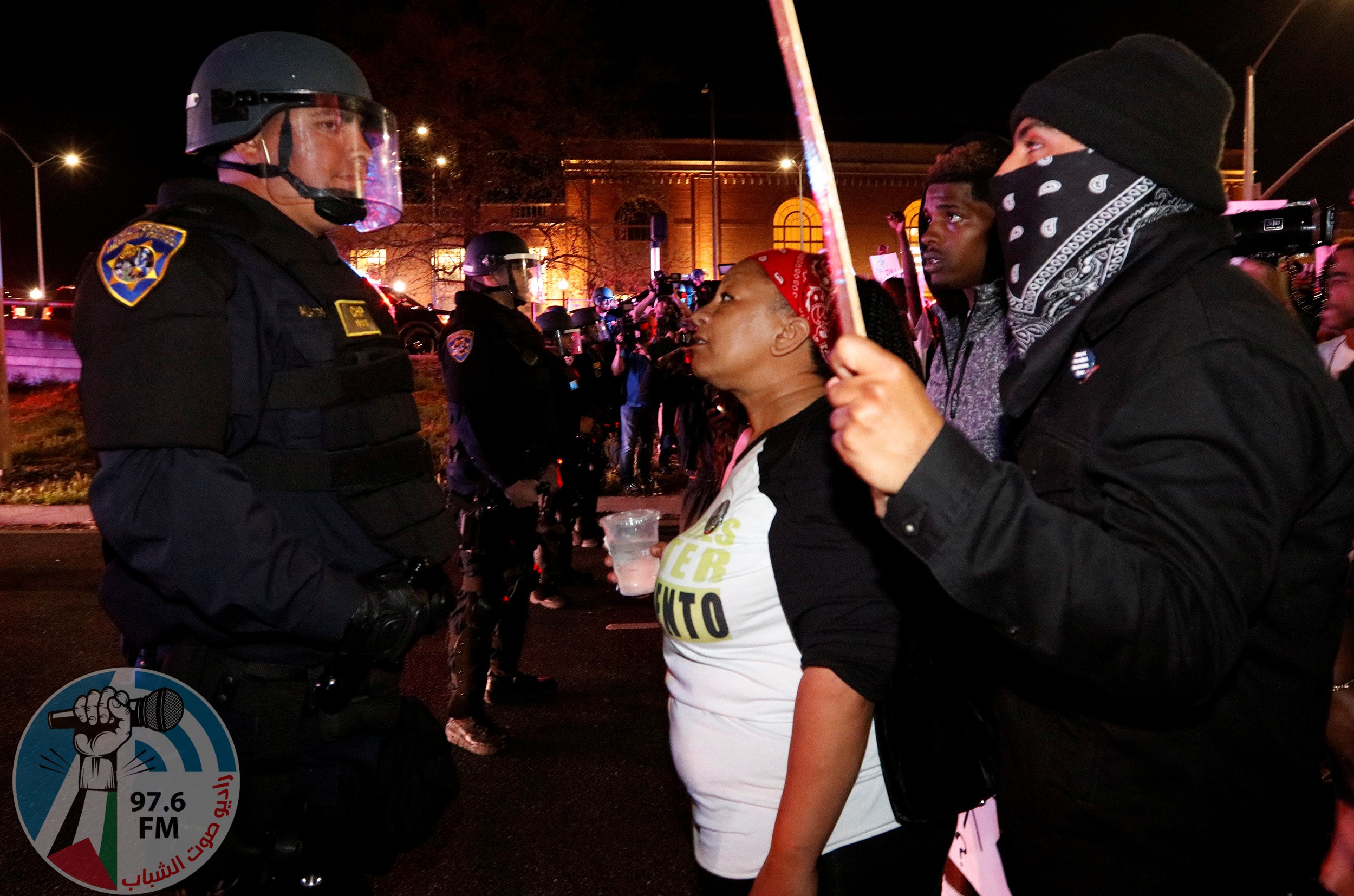 Demonstrators face off with California Highway Patrol officers as they protest the police shooting of Stephon Clark, in Sacramento, California, U.S., March 30, 2018. REUTERS/Bob Strong