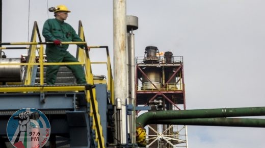 A worker looks out from an access platform above a crude oil storage tank in the Duna oil refinery, operated by MOL Hungarian Oil & Gas Plc, in Szazhalombatta, Hungary, on Monday, April 10, 2017. MOL Group posted almost $1 Billion profit in 2016. Photographer: Oliver Bunic/Bloomberg