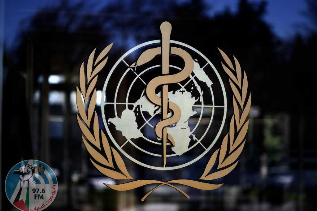 A photo taken on February 24, 2020, shows the logo of the World Health Organization (WHO) at the entrance of their headquarters in Geneva. (Photo by Fabrice COFFRINI / AFP)