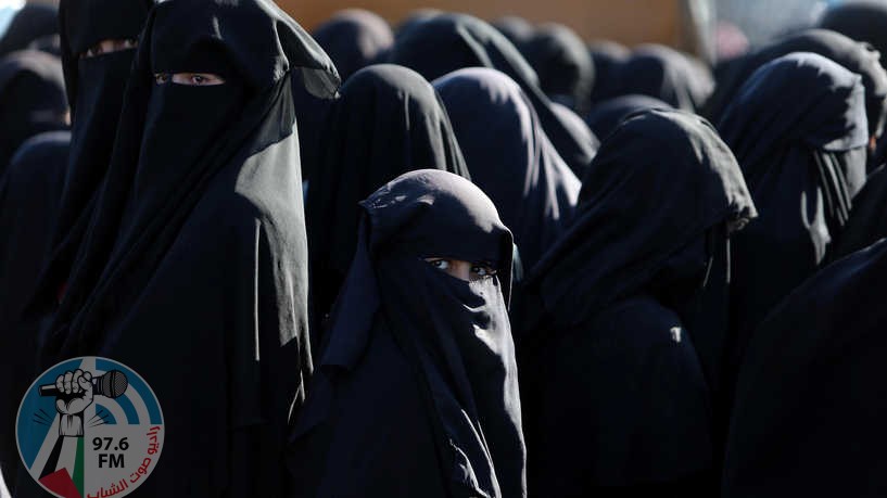 Women stand together al-Hol displacement camp in Hasaka governorate, Syria, April 2, 2019. REUTERS/Ali Hashisho