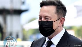 FILE PHOTO: Elon Musk wears a protective mask as he arrives to attend a meeting with the leadership of the conservative CDU/CSU parliamentary group, in Berlin, Germany September 2, 2020. Tobias Schwarz/Pool via REUTERS/File Photo