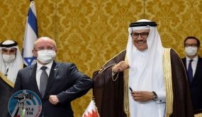 Bahraini Foreign Minister Abdullatif bin Rashid Al-Zayani (R) and head of the Israeli delegation National Security Advisor Meir Ben Shabbat, bump elbows after a signing ceremony attended by US Treasury Secretary Steve Mnuchin (back), in Bahrain's capital Manama, on October 18, 2020. - Israel and Bahrain cemented a deal officially establishing relations and signed several memorandums of understanding, further opening up the wealthy Gulf region to the Jewish state. (Photo by Mazen Mahdi / AFP)