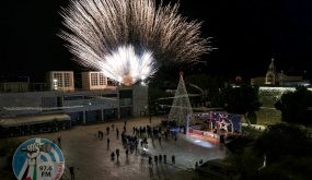 This picture taken on December 5, 2020 shows a fireworks display during the lighting of the Christmas tree in the biblical city of Bethlehem in the occupied West Bank, closed to the public due to the COVID-19 coronavirus pandemic. - Bethlehem lit up its Christmas tree evening on December 5 but without the usual crowds, as novel coronavirus restrictions put a damper on the start of Christmas festivities in the holy city. Palestinian authorities had the prior week announced measures, including a night-time curfew, across the Israeli-occupied West Bank for 14 days to fight a "worrying spread" of the virus. (Photo by EMMANUEL DUNAND / AFP) (Photo by EMMANUEL DUNAND/AFP via Getty Images)