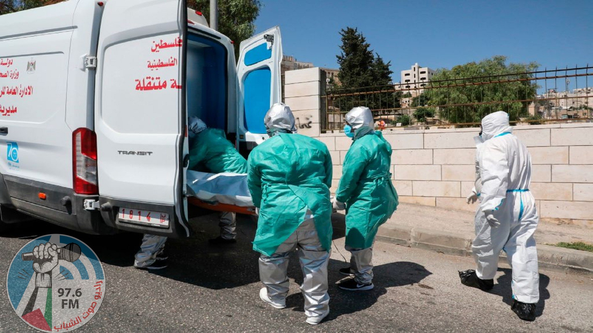 Staff of the Palestinian Ministry of Health in full hazmat suits transport the body of 47-year-old Palestinian COVID-19 victim Nassra Abu Hussein for burial in the West Bank city of Hebron, on June 29, 2020. (Photo by HAZEM BADER / AFP) (Photo by HAZEM BADER/AFP via Getty Images)