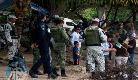 National guard members stand guard along the banks of the Suchiate river in Ciudad Hidalgo, Chiapas State, Mexico, to prevent illegal crossings across the border river to and from Tecun Uman in Guatemala, on July 3, 2019. (Photo by STR / AFP)