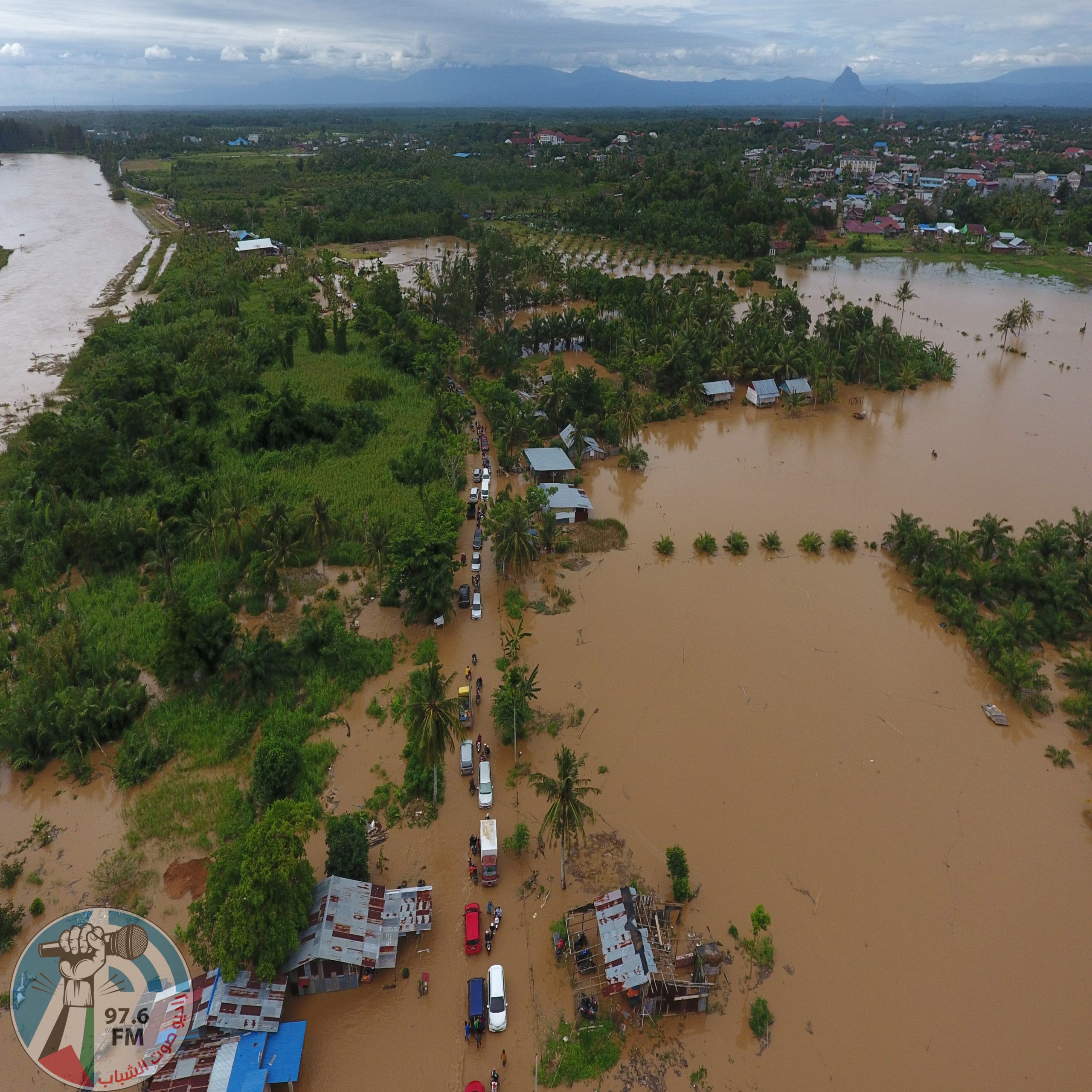 This aerial picture taken on April 27, 2019 shows a general view of submerged buildings after heavy rain caused flooding in Bengkulu on the Indonesian island of Sumatra. - At least 10 people are dead and eight are missing after days of heavy rain-triggered floods and landslides on the Indonesian island of Sumatra, authorities said on April 28. (Photo by DIVA MARHA / AFP)