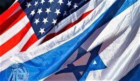 U.S. and Israeli flags fly as U.S. Secretary of State John Kerry arrives in Tel Aviv, Israel, Tuesday, Nov. 24, 2015. (AP Photo/Jacquelyn Martin, Pool)