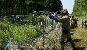 Lithuanian army soldiers install razor wire on border with Belarus in Druskininkai, Lithuania July 9, 2021. REUTERS/Janis Laizans