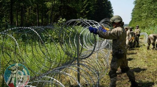 Lithuanian army soldiers install razor wire on border with Belarus in Druskininkai, Lithuania July 9, 2021. REUTERS/Janis Laizans