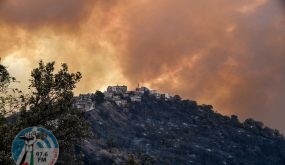 Smoke rises from a wildfire in the forested hills of the Kabylie region, east of the capital Algiers, on August 10, 2021. At least five people have died in raging wildfires in Algeria as firefighters battle more than 31 blazes amid blistering temperatures and tinder-dry conditions, officials said. (Photo by Ryad KRAMDI / AFP)
