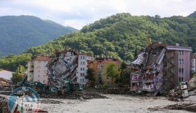 The front of two buildings are collapsed after the Ezine river broke it's banks during flash floods in Bozkurt in the district of Kastamonu, in the Black Sea region of Turkey on August 14, 2021. Turkey battled disaster on two fronts on August 14, 2021, with eight people dying when a fire-fighting aircraft crashed and rescuers racing to find survivors of flash floods in the north that have killed at least 55. (Photo by AFP)
