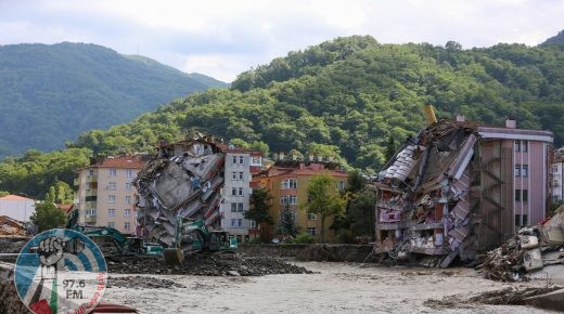 The front of two buildings are collapsed after the Ezine river broke it's banks during flash floods in Bozkurt in the district of Kastamonu, in the Black Sea region of Turkey on August 14, 2021. Turkey battled disaster on two fronts on August 14, 2021, with eight people dying when a fire-fighting aircraft crashed and rescuers racing to find survivors of flash floods in the north that have killed at least 55. (Photo by AFP)