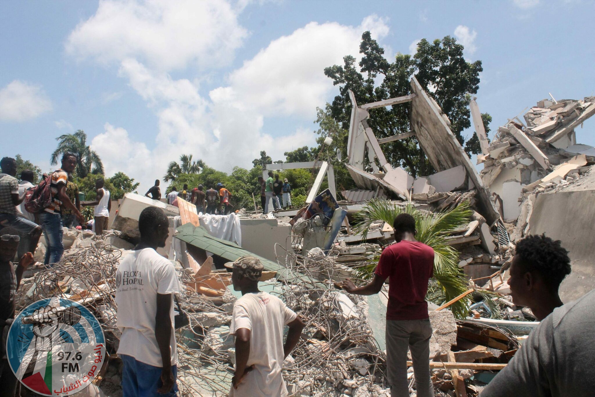 TOPSHOT - People search through the rubble of what used to be the Manguier Hotel after the earthquake hit on August 14, 2021 in Les Cayes, southwest Haiti. Rescue workers scrambled to find survivors after a powerful 7.2-magnitude earthquake struck Haiti early Saturday, killing at least 304 and toppling buildings in the disaster-plagued Caribbean nation still recovering from a devastating 2010 quake.
The epicenter of the shaking, which rattled homes and sent terrified locals scrambling for safety, was about 100 miles (160 kilometers) by road west of the center of the densely populated capital Port-au-Prince. (Photo by Stanley LOUIS / AFP)