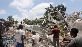 TOPSHOT - People search through the rubble of what used to be the Manguier Hotel after the earthquake hit on August 14, 2021 in Les Cayes, southwest Haiti. Rescue workers scrambled to find survivors after a powerful 7.2-magnitude earthquake struck Haiti early Saturday, killing at least 304 and toppling buildings in the disaster-plagued Caribbean nation still recovering from a devastating 2010 quake.
The epicenter of the shaking, which rattled homes and sent terrified locals scrambling for safety, was about 100 miles (160 kilometers) by road west of the center of the densely populated capital Port-au-Prince. (Photo by Stanley LOUIS / AFP)
