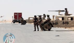 Jordanian soldiers stand guard near their military vehicles at the Al-Karameh border point with Iraq on June 25, 2014 as Jordan reinforced its border with Iraq after Sunni Arab militants overran a crossing with Syria. Sunni insurgents led by the jihadist Islamic State of Iraq and the Levant (ISIL) overran swathes of land north and west of Baghdad this month sparking fears in Amman that they will take the fight to Jordan, which is already struggling with its own home-grown Islamists. AFP PHOTO/STR