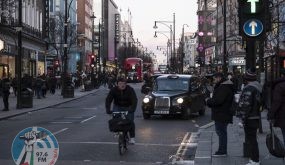 LONDON, UNITED KINGDOM - 2018/01/30: A man seen riding a bicycle in London famous Oxford street. Central London is one of the most attractive tourist attraction for individuals whose willing to shop and enjoy the variety of famous and worldwide brands. (Photo by Rahman Hassani/SOPA Images/LightRocket via Getty Images)