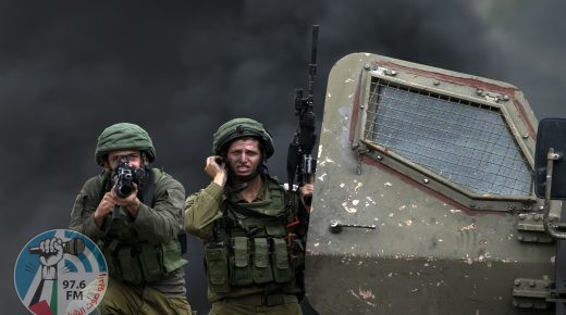 TOPSHOT - An Israeli soldier aims his weapon during clashes with Palestinian protesters following a demonstration against the expropriation of Palestinian land by Israel in the village of Kfar Qaddum, near Nablus in the occupied West Bank, on September 15, 2017. / AFP PHOTO / JAAFAR ASHTIYEH (Photo credit should read JAAFAR ASHTIYEH/AFP/Getty Images)