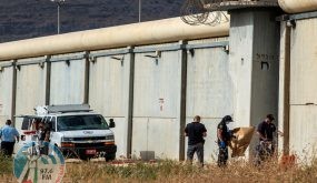 Israeli security personnel stand together outside the walls of Gilboa prison after six Palestinian militants broke out of it in north Israel September 6, 2021. REUTERS/ Gil Eliyahu