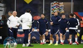 France's assistant coach Guy Stephan (L), France's defender Leo Dubois (C) and France's defender Lucas Hernandez (R) arrive for a training session at the San Siro Stadium in Milan on October 9, 2021, on the eve of the UEFA Nations League final football match between Spain and France. (Photo by FRANCK FIFE / AFP)