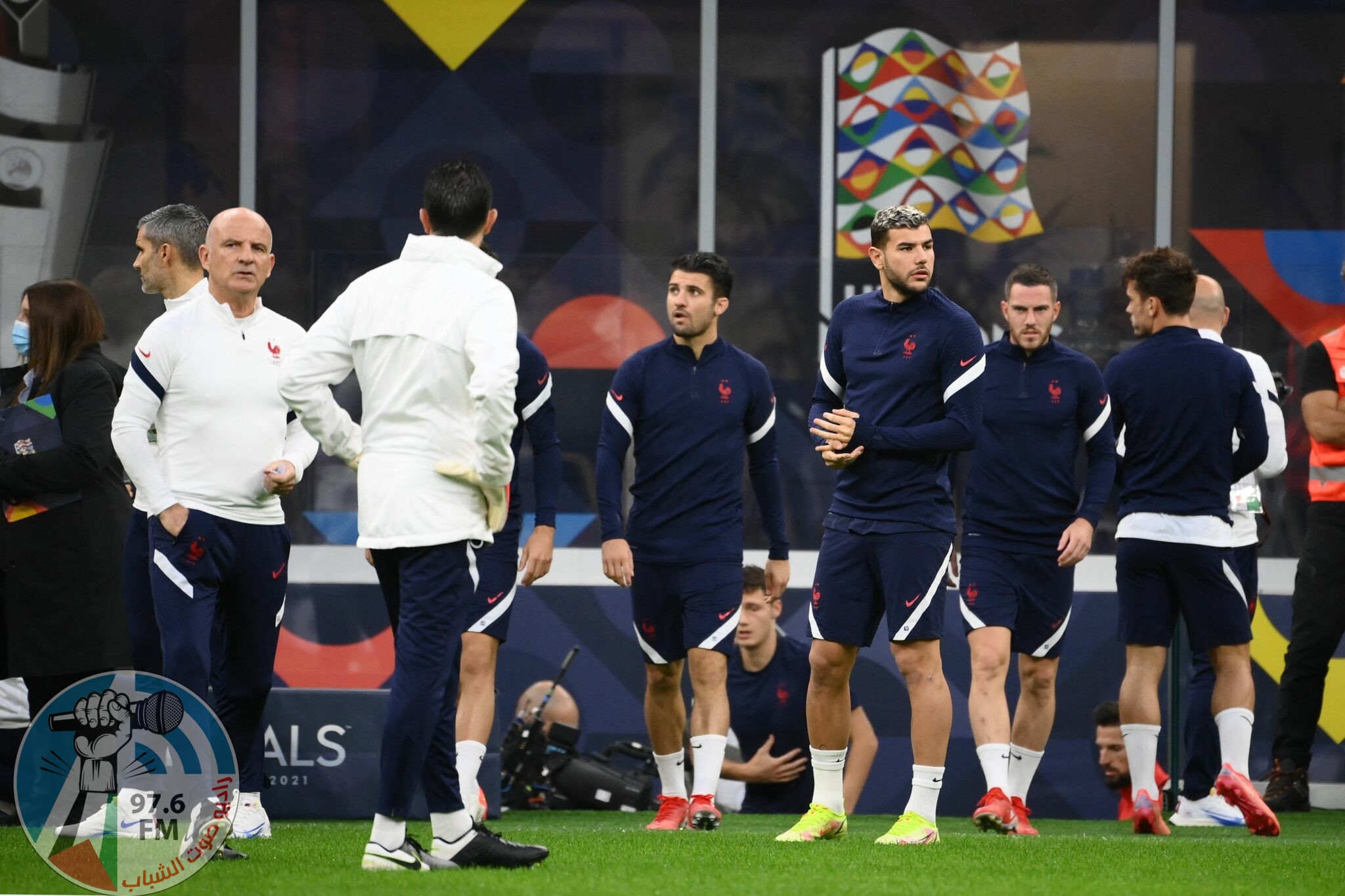 France's assistant coach Guy Stephan (L), France's defender Leo Dubois (C) and France's defender Lucas Hernandez (R) arrive for a training session at the San Siro Stadium in Milan on October 9, 2021, on the eve of the UEFA Nations League final football match between Spain and France. (Photo by FRANCK FIFE / AFP)