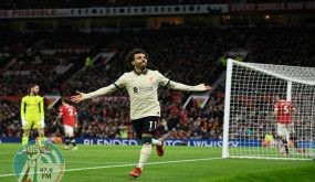 TOPSHOT - Liverpool's Egyptian midfielder Mohamed Salah celebrates after scoring their fifth goal, his third during the English Premier League football match between Manchester United and Liverpool at Old Trafford in Manchester, north west England, on October 24, 2021. RESTRICTED TO EDITORIAL USE. No use with unauthorized audio, video, data, fixture lists, club/league logos or 'live' services. Online in-match use limited to 120 images. An additional 40 images may be used in extra time. No video emulation. Social media in-match use limited to 120 images. An additional 40 images may be used in extra time. No use in betting publications, games or single club/league/player publications. (Photo by Oli SCARFF / AFP) / RESTRICTED TO EDITORIAL USE. No use with unauthorized audio, video, data, fixture lists, club/league logos or 'live' services. Online in-match use limited to 120 images. An additional 40 images may be used in extra time. No video emulation. Social media in-match use limited to 120 images. An additional 40 images may be used in extra time. No use in betting publications, games or single club/league/player publications.