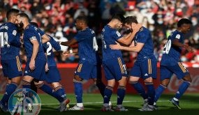 Real Madrid's Spanish defender Nacho Fernandez (2nd-R) celebrates with teammates after scoring his team's second goal during the Spanish League football match between Granada FC and Real Madrid CF at Nuevo Los Carmenes stadium in Granada on November 21, 2021. (Photo by JORGE GUERRERO / AFP)