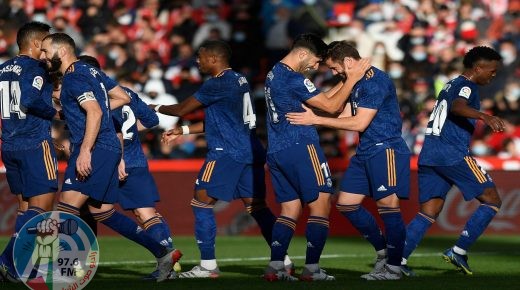 Real Madrid's Spanish defender Nacho Fernandez (2nd-R) celebrates with teammates after scoring his team's second goal during the Spanish League football match between Granada FC and Real Madrid CF at Nuevo Los Carmenes stadium in Granada on November 21, 2021. (Photo by JORGE GUERRERO / AFP)