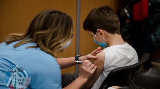 A child, 11, receives the Pfizer-BioNTech Covid-19 vaccine for children in Montreal, Quebec on November 24, 2021. Today is the first day that children are allowed to receive the version of the vaccine designed for children aged 5 to 11 years old in Canada. (Photo by Andrej Ivanov / AFP)