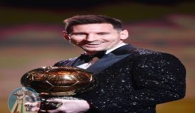 Paris Saint-Germain's Argentine forward Lionel Messi reacts after being awarded the the Ballon d'Or award during the 2021 Ballon d'Or France Football award ceremony at the Theatre du Chatelet in Paris on November 29, 2021. (Photo by FRANCK FIFE / AFP)