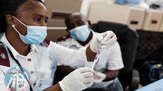 Health care workers prepare doses of the Pfizer vaccine ahead of a vaccination during the launch of the VaxuMzansi National Vaccine Day Campaign at the Gandhi Phoenix Settlement in Bhambayi township, north of Durban , on September 24, 2021. - The campaign launched by the Religious Forum Against Covid-19 (RFA) is an inter-faith collaboration of various religious communities standing together to fight the spread of the pandemic. The campaign aims to encourage congregations and followers to vaccinate with a sense of urgency to increase vaccine uptake. (Photo by Rajesh JANTILAL / AFP)