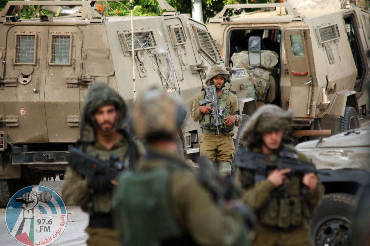 Israeli forces stand guard after an Israeli soldier was killed by a rock thrown during an arrest raid, in Yabad near the West Bank, city of Jenin, on May 13, 2020. Photo by Oday Daibes