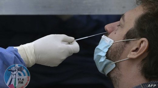 A health worker wearing protective gear collects a nasal swab for a Covid-19 PCR test at Plaza de Mayo square in Buenos Aires, on May 28, 2021. (Photo by JUAN MABROMATA / AFP)