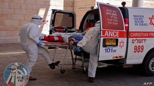 Medics with the Magen David Adom transfer a Coronavirus patient to the Hadassah Ein Kerem Hospital in Jerusalem due to full capacity in other hospitals, following a sharp increase in the number of coronavirus infections in Israel, on August 15, 2021. (Photo by Menahem KAHANA / AFP)
