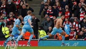 Manchester City's Spanish midfielder Rodri (R) celebrates scoring his team's second goal during the English Premier League football match between Arsenal and Manchester City at the Emirates Stadium in London on January 1, 2022. Manchester City won the match 2-0. - RESTRICTED TO EDITORIAL USE. No use with unauthorized audio, video, data, fixture lists, club/league logos or 'live' services. Online in-match use limited to 120 images. An additional 40 images may be used in extra time. No video emulation. Social media in-match use limited to 120 images. An additional 40 images may be used in extra time. No use in betting publications, games or single club/league/player publications. (Photo by Adrian DENNIS / AFP) / RESTRICTED TO EDITORIAL USE. No use with unauthorized audio, video, data, fixture lists, club/league logos or 'live' services. Online in-match use limited to 120 images. An additional 40 images may be used in extra time. No video emulation. Social media in-match use limited to 120 images. An additional 40 images may be used in extra time. No use in betting publications, games or single club/league/player publications.