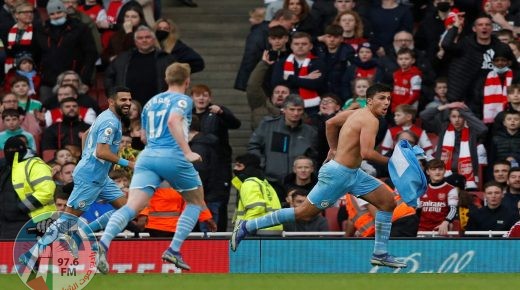 Manchester City's Spanish midfielder Rodri (R) celebrates scoring his team's second goal during the English Premier League football match between Arsenal and Manchester City at the Emirates Stadium in London on January 1, 2022. Manchester City won the match 2-0. - RESTRICTED TO EDITORIAL USE. No use with unauthorized audio, video, data, fixture lists, club/league logos or 'live' services. Online in-match use limited to 120 images. An additional 40 images may be used in extra time. No video emulation. Social media in-match use limited to 120 images. An additional 40 images may be used in extra time. No use in betting publications, games or single club/league/player publications. (Photo by Adrian DENNIS / AFP) / RESTRICTED TO EDITORIAL USE. No use with unauthorized audio, video, data, fixture lists, club/league logos or 'live' services. Online in-match use limited to 120 images. An additional 40 images may be used in extra time. No video emulation. Social media in-match use limited to 120 images. An additional 40 images may be used in extra time. No use in betting publications, games or single club/league/player publications.