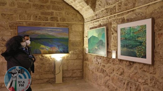 Visitors look at a paintings by Lebanese artists Shawki Chamoun (C) and Jamil Molaeb (R) during an exhibit showcasing art installations that were restored as part of a UNESCO initiative, after being damaged during the August 4 2020 port blast, at the Beirut Museum of Art in the Lebanese capital on January 20, 2022. - RESTRICTED TO EDITORIAL USE - MANDATORY MENTION OF THE ARTIST UPON PUBLICATION - TO ILLUSTRATE THE EVENT AS SPECIFIED IN THE CAPTION (Photo by ANWAR AMRO / AFP) / RESTRICTED TO EDITORIAL USE - MANDATORY MENTION OF THE ARTIST UPON PUBLICATION - TO ILLUSTRATE THE EVENT AS SPECIFIED IN THE CAPTION