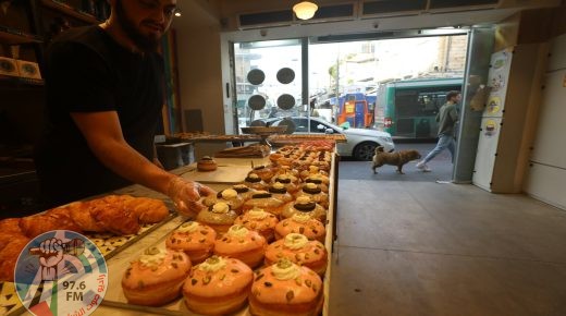 (211206) -- JERUSALEM, Dec. 6, 2021 (Xinhua) -- Sufganiyots, round jelly donuts eaten on the Jewish festival of Hanukkah, are seen at a shop during Hanukkah in Jerusalem on Dec. 6, 2021. (Photo by Muammar Awad/Xinhua)