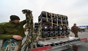 Ukrainian servicemen unload a Boeing 747-412 plane with the FGM-148 Javelin, American man-portable anti-tank missile provided by US to Ukraine as part of a military support, at Kyiv's airport Boryspil on February 11,2022, amid the crisis linked with the threat of Russia's invasion. (Photo by Sergei SUPINSKY / AFP)