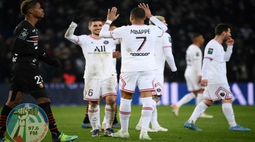 Paris Saint-Germain's French forward Kylian Mbappe celebrates with teammates after scoring during the French L1 football match between Paris-Saint Germain (PSG) and Le Stade rennais Football Club at The Parc des Princes Stadium in Paris on February 11, 2022. (Photo by FRANCK FIFE / AFP)