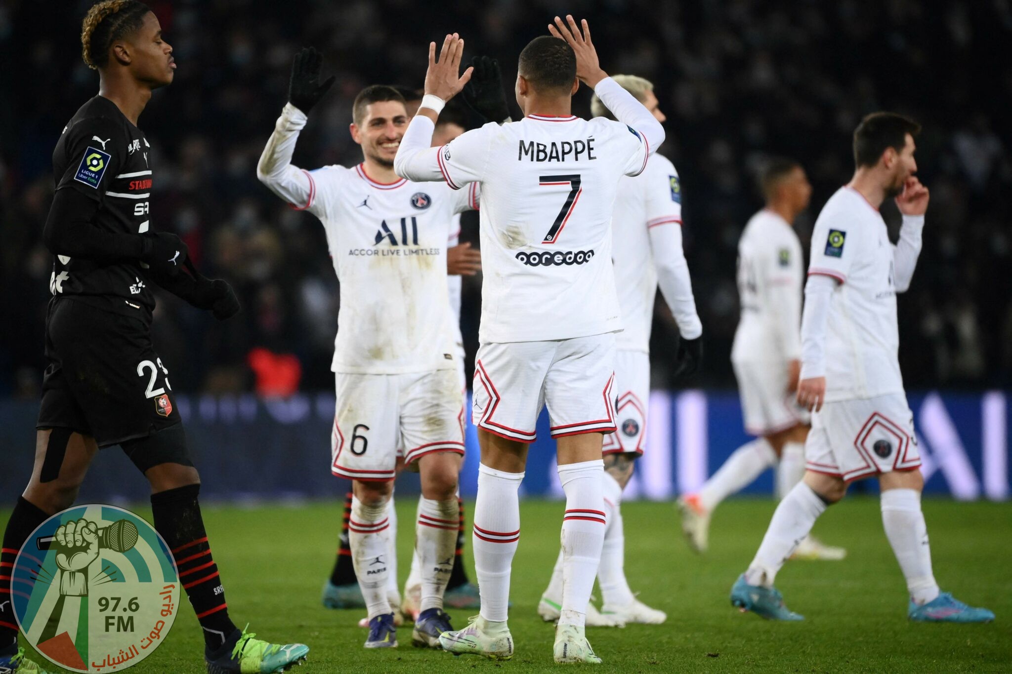 Paris Saint-Germain's French forward Kylian Mbappe celebrates with teammates after scoring during the French L1 football match between Paris-Saint Germain (PSG) and Le Stade rennais Football Club at The Parc des Princes Stadium in Paris on February 11, 2022. (Photo by FRANCK FIFE / AFP)