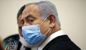 Israeli Prime Minister Benjamin Netanyahu, wearing a protective face maks, is pictured inside a courtroom at the district court of Jerusalem on May 24, 2020, during the first day of his corruption trial. - Fresh from forming a new government after more than 500 days of electoral deadlock, Netanyahu is expected to begin a new battle in the Jerusalem District Court -- to stay out of prison. The 70-year-old was scheduled to appear at a court hearing to formally confirm his identity to judges, after being indicted in January for bribery, fraud and breach of trust. (Photo by RONEN ZVULUN / POOL / AFP)