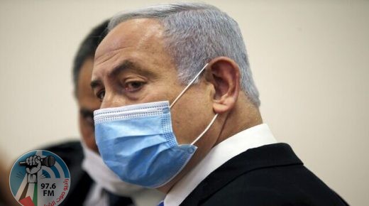Israeli Prime Minister Benjamin Netanyahu, wearing a protective face maks, is pictured inside a courtroom at the district court of Jerusalem on May 24, 2020, during the first day of his corruption trial. - Fresh from forming a new government after more than 500 days of electoral deadlock, Netanyahu is expected to begin a new battle in the Jerusalem District Court -- to stay out of prison. The 70-year-old was scheduled to appear at a court hearing to formally confirm his identity to judges, after being indicted in January for bribery, fraud and breach of trust. (Photo by RONEN ZVULUN / POOL / AFP)