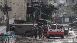 Israeli soldiers prepare to check a Palestinian Red Crescent ambulance at the entrance of the Tulkarem refugee camp in Tulkarem, in the occupied West Bank, on January 17, 2024 during a military operation. (Photo by MARCO LONGARI / AFP) / The erroneous mention appearing in the metadata of this photo by MARCO LONGARI has been modified in AFP systems in the following manner: [Red Crescent ambulance] instead of [Red Cross ambulance]. Please immediately remove the erroneous mention from all your online services and delete it from your servers. If you have been authorized by AFP to distribute it to third parties, please ensure that the same actions are carried out by them. Failure to promptly comply with these instructions will entail liability on your part for any continued or post notification usage. Therefore we thank you very much for all your attention and prompt action. We are sorry for the inconvenience this notification may cause and remain at your disposal for any further information you may require.